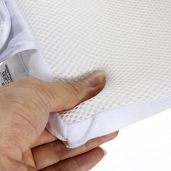 Hand pressing the pillow